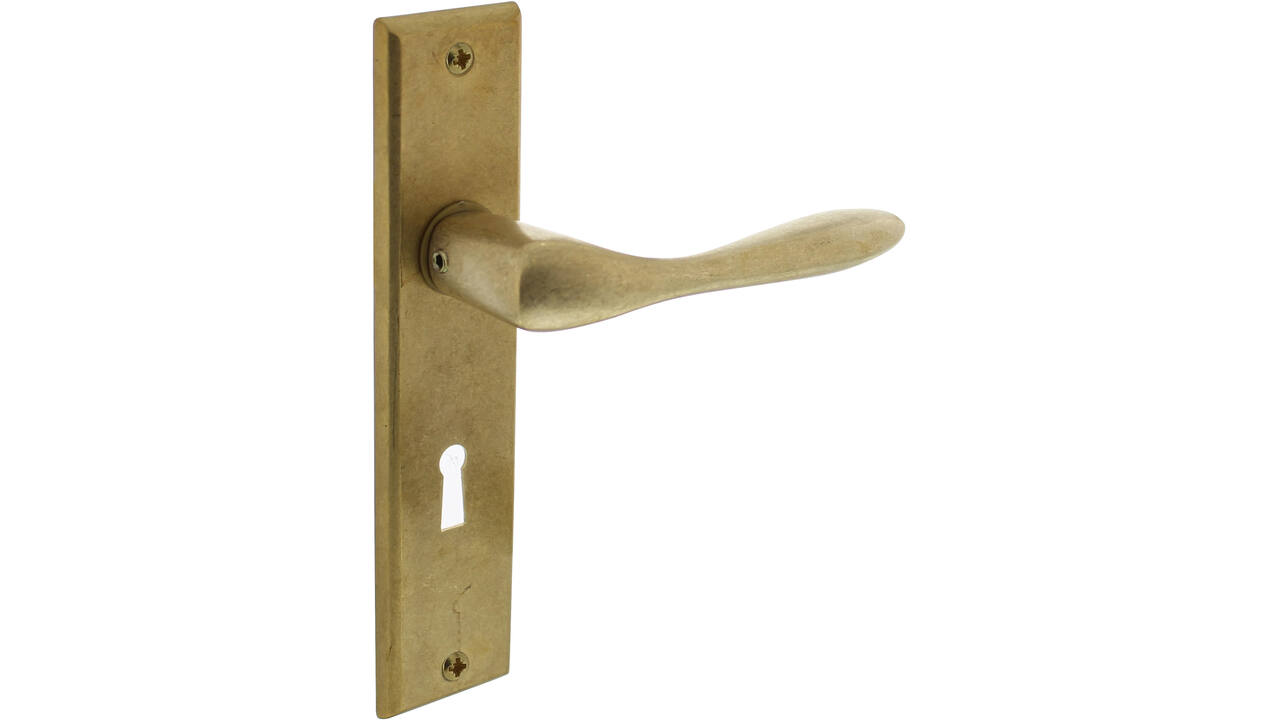 Deurkruk Banaan met schild rechthoekig 181x41mm sleutelgat 56mm messing getrommeld