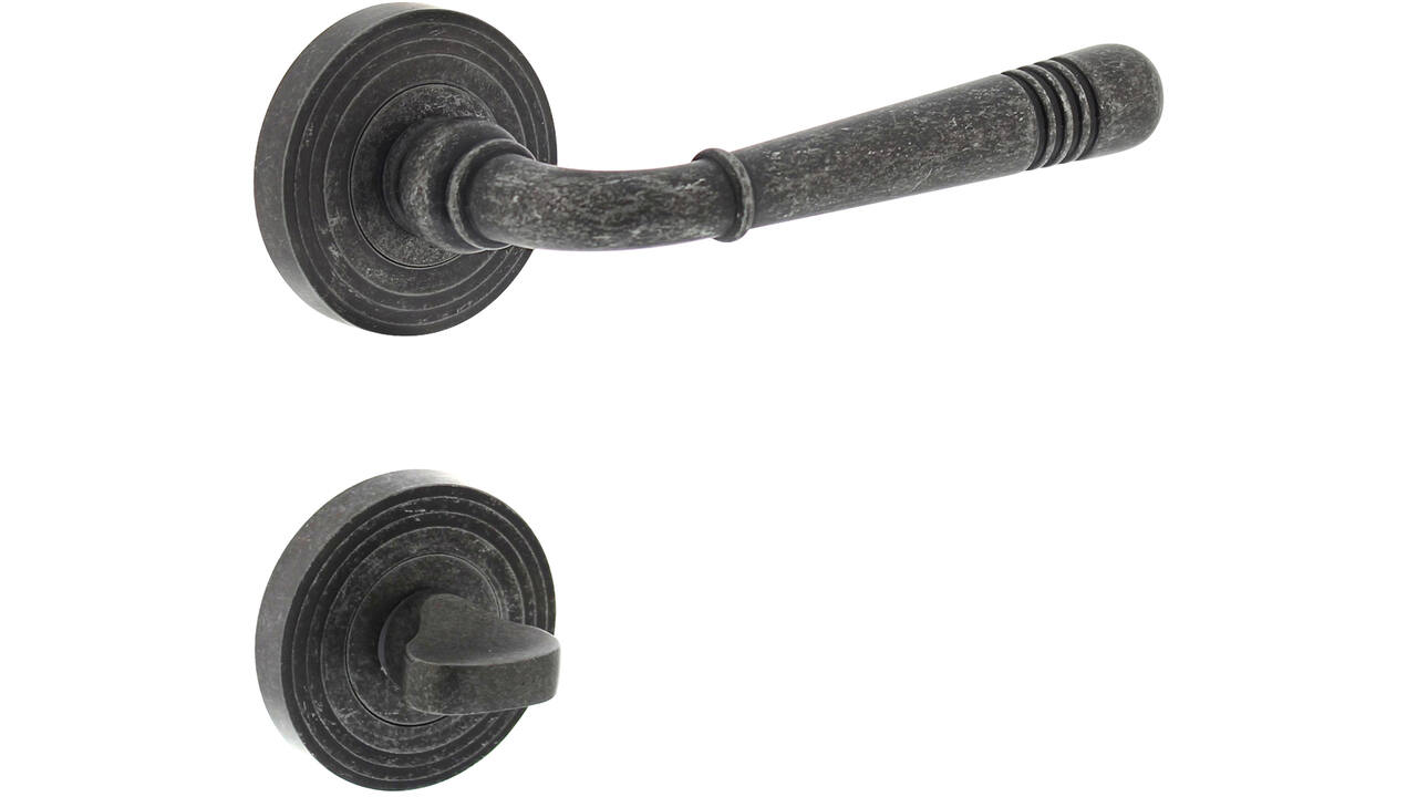 Deurkruk Helena op rozet verdekt met rillen ø55x10mm met nokken en WC-sluiting met stift 8x8mm oud grijs