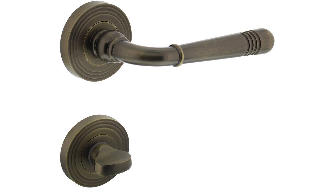 Deurkruk Helena op rozet verdekt met rillen ø55x10mm met nokken en WC-sluiting met stift 8x8mm gebruineerd