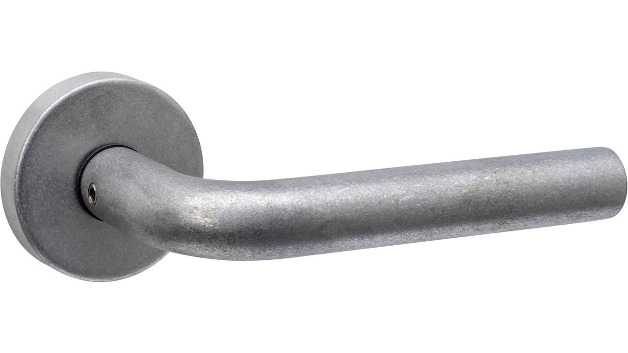 Deurkruk Luzern met rozet massief verdekt ø53x10mm met nokken rvs getrommeld