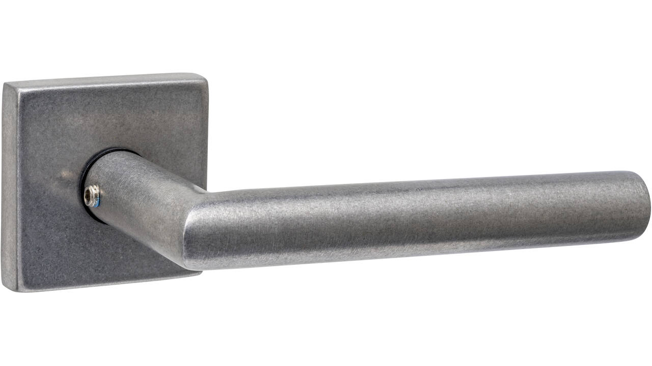 Deurkruk Jura met rozet massief verdekt 53x53x10mm met nokken rvs getrommeld
