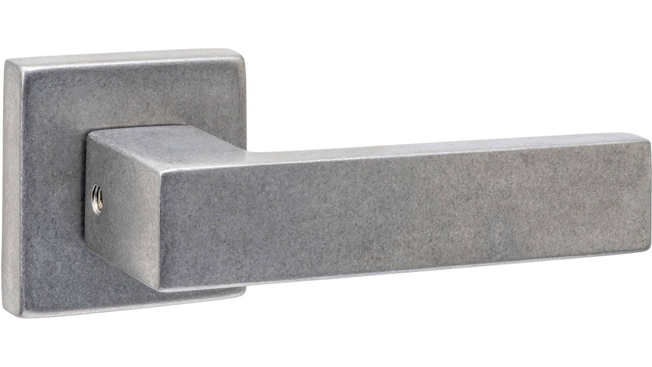 Deurkruk Amsterdam met rozet massief verdekt 53x53x10mm met nokken rvs getrommeld