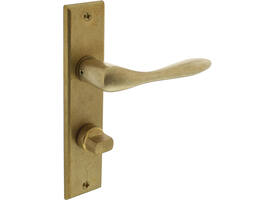 Deurkruk Banaan met schild rechthoekig 181x41mm wc 63/8mm messing getrommeld