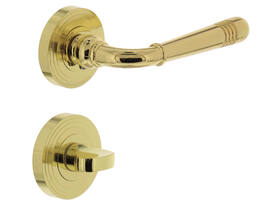 Deurkruk Helena op rozet verdekt met rillen ø55x10mm met nokken en WC-sluiting met stift 8x8mm PVD messingkleur
