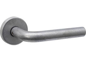 Deurkruk Luzern met rozet massief verdekt ø53x10mm met nokken rvs getrommeld